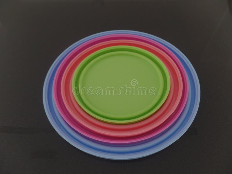 Multi coloured round plastic lids royalty free stock photos
