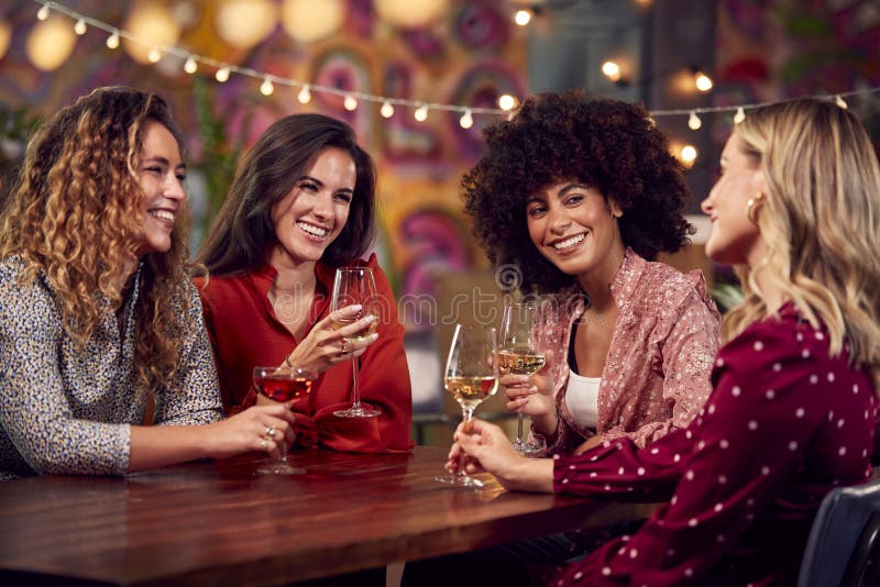 Multi Cultural Group Of Female Friends Enjoying Party Night Out In Bar Stock Image Image Of