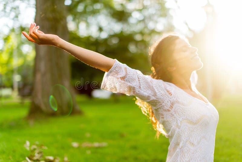 Multi-ethnic girl enjoying the warmth of a sunset royalty free stock image Multi-ethnic girl enjoying the warmth of a sunset royalty free stock image