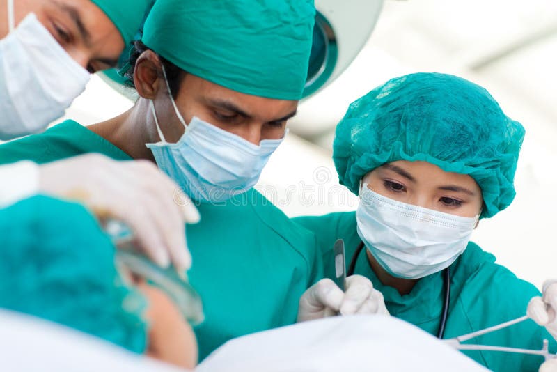 Multi-ethnic surgeons during a surgery