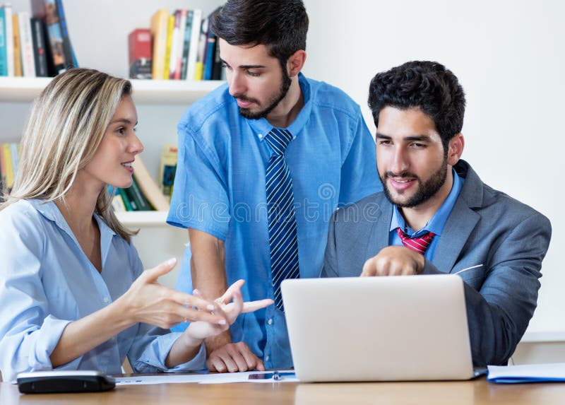 Multi ethnic team of male and female business trainees in discussion stock photos