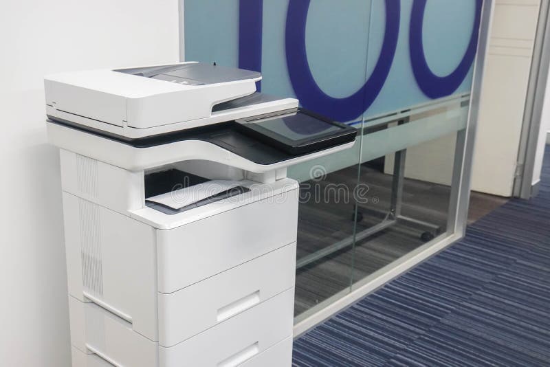 Multi functional printer in front of the office meeting room for scan and xerox business documents. Close up standing multi functional printer in front of the royalty free stock photo Multi functional printer in front of the office meeting room for scan and xerox business documents. Close up standing multi functional printer in front of the royalty free stock photo