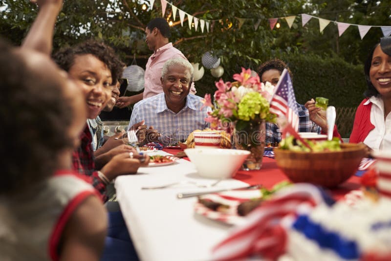 Multi Generation Black Family Having a 4th July Barbecue Stock Photo ...