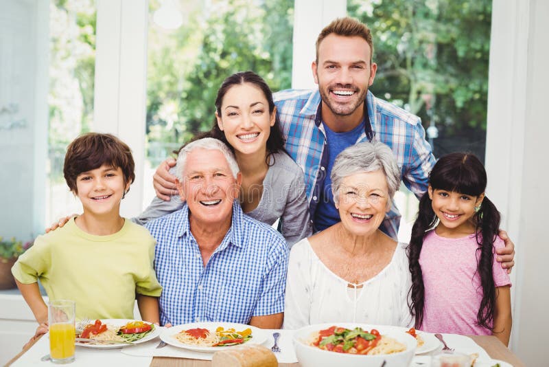 Multi Generation Family at Dining Table Stock Image - Image of ...