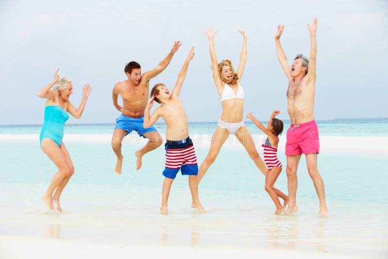 Multi Generation Family Having Fun In Sea On Beach Holiday stock photography Multi Generation Family Having Fun In Sea On Beach Holiday stock photography