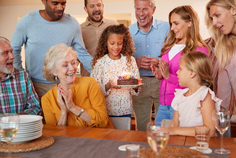 Multi-Generation Family Meet To Celebrate Grandmothers Birthday At Home Together stock photography