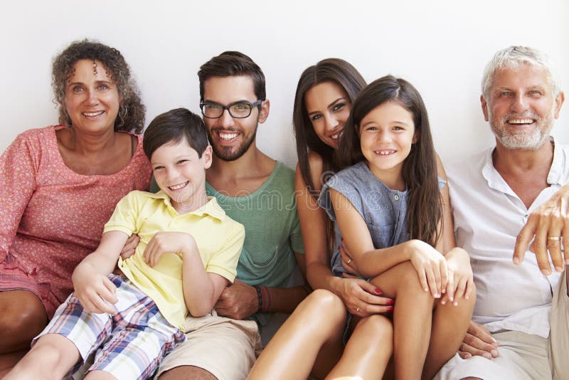 Multi Generation Family Sitting Against Wall royalty free stock photos Multi Generation Family Sitting Against Wall royalty free stock photos