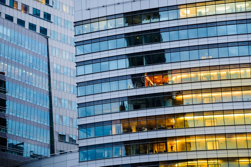 Multi storey building. Abstract texture of blue glass modern off