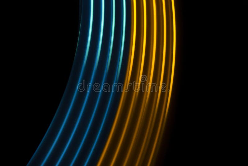 Yellow and blue light dynamic lines on a black background. Yellow and blue light dynamic lines on a black background