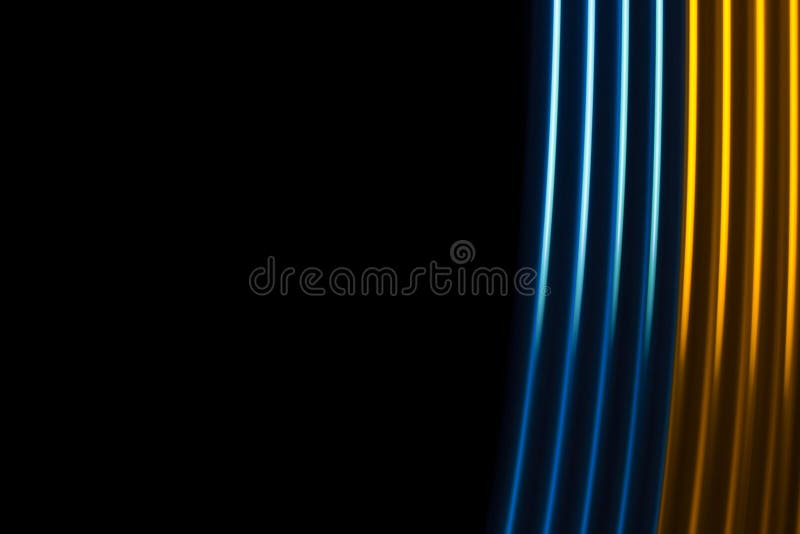 Yellow and blue light dynamics lines on a black background. Yellow and blue light dynamics lines on a black background