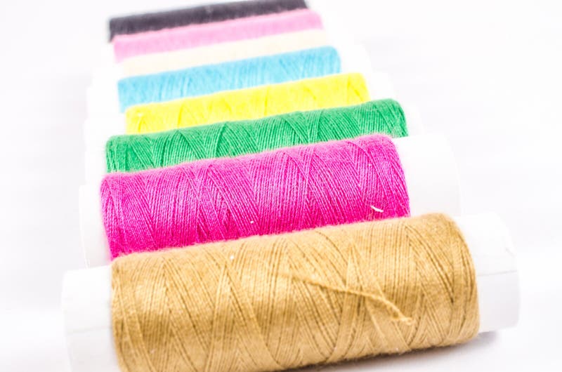 Multicolor Sewing Threads on White Background, Stock Photo - Image of ...