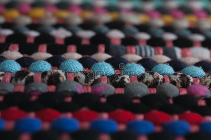 Multicolored fabric texture and background. Close up view of colorful carpet with selective focus. royalty free stock photography