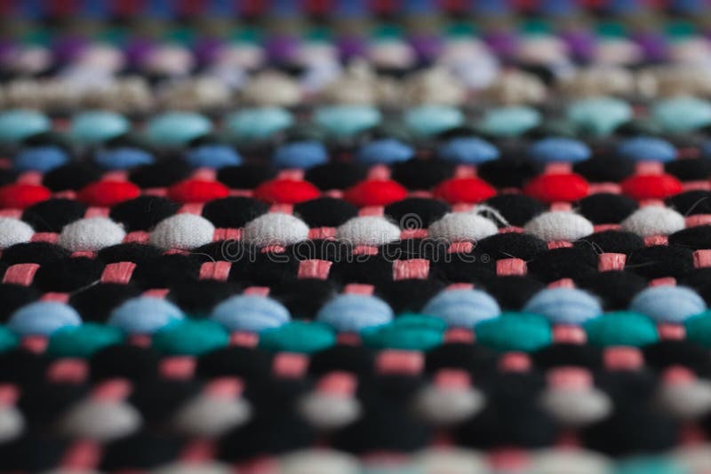 Multicolored fabric texture and background. Close up view of colorful carpet with selective focus. stock images