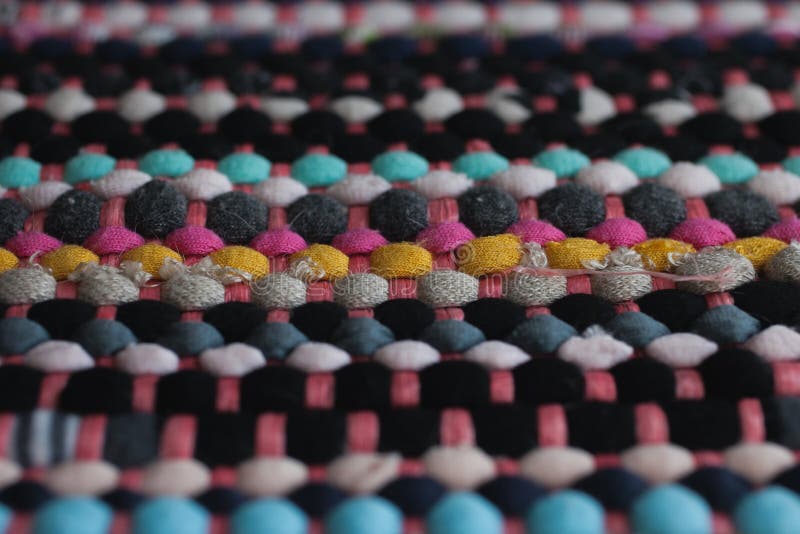Multicolored fabric texture and background. Close up view of colorful carpet with selective focus. stock photography