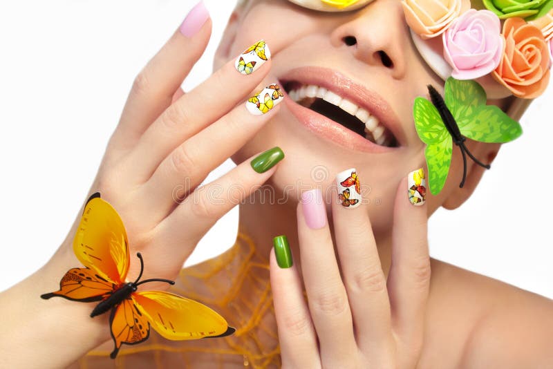 Multicolored manicure with pictures of butterflies. royalty free stock images Multicolored manicure with pictures of butterflies. royalty free stock images