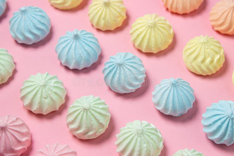 Meringue of different colors folded in several rows by color stock photography