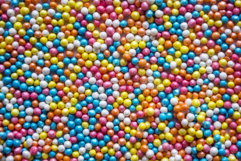 Multicolored Pastel Sprinkles Background. Colorful Little Candies