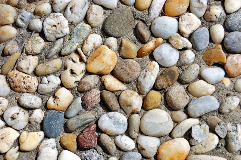 Multicolored pebble stones texture useful as natural background. Sand fragment stock images, royalty-free photos and pictures