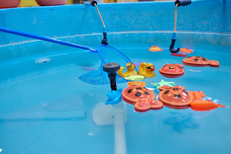 https://thumbs.dreamstime.com/b/multicolored-plastic-toy-fish-pool-children-s-fishing-concept-game-246559831.jpg