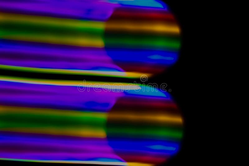 multicolored rainbow lines on black background.