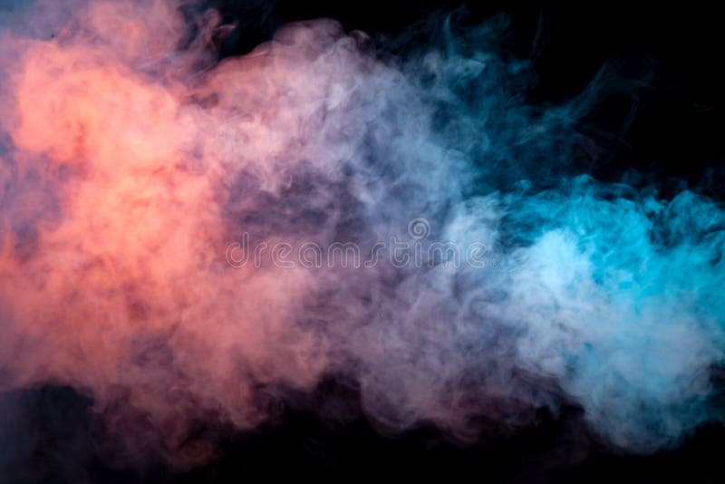 Multicolored smoke from a vape of blue and purple color of the exhaled by a pillar on a black isolated background. Bright clouds in the abstract form