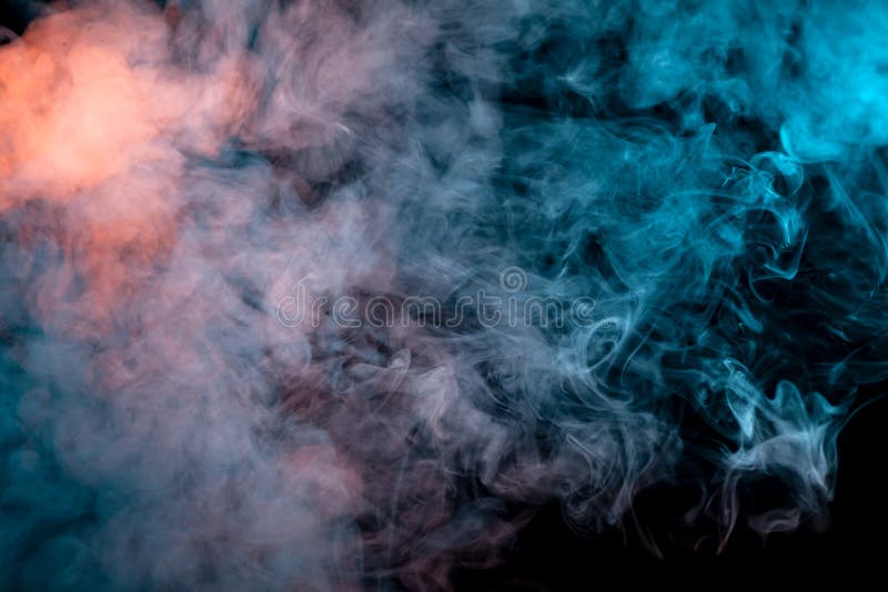 Multicolored smoke from a vape of blue and purple color of the strange mystical form on on a black isolated background. Bright clouds in the abstract form