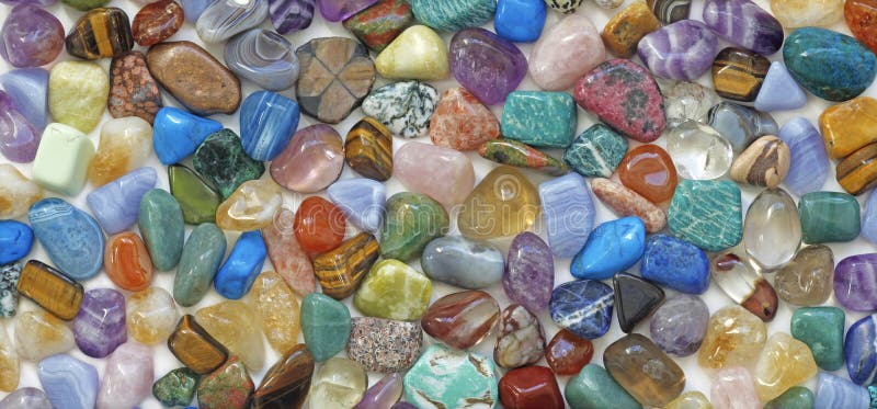 Multicolored tumbled crystal stones background