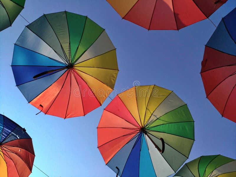 Multicolored umbrellas against the sky in the backlight. Balloon, bright.