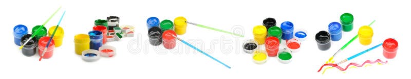 Multicolored watercolor and gouache paints and brushes isolated on white stock photo