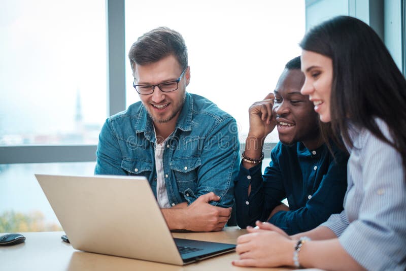 Multicultural group of students discussing project stock photos Multicultural group of students discussing project stock photos