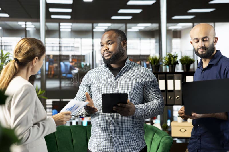 Multiethnic colleagues pitching investment strategy to manager stock images