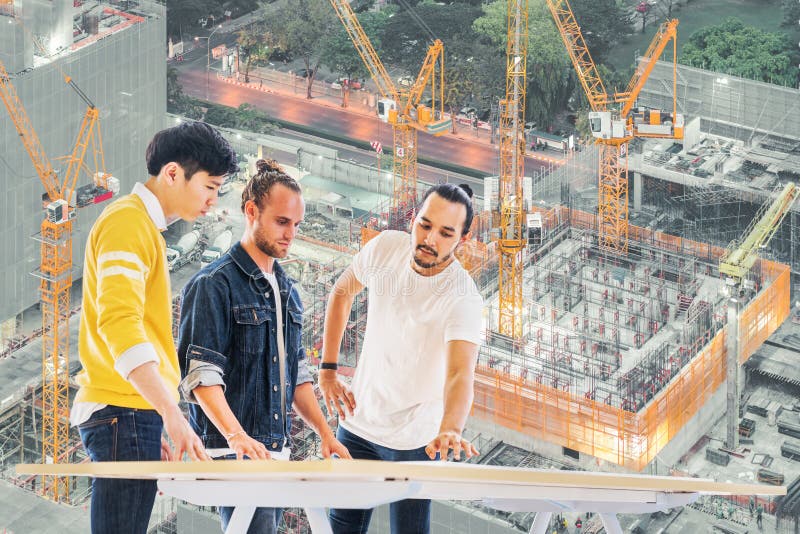Multiethnic engineer, architect team work together on building development project planning, under construction site background stock photo Multiethnic engineer, architect team work together on building development project planning, under construction site background stock photo