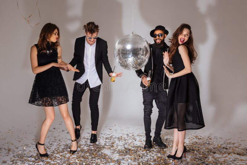 Multiethnic group of attractive joyful young people dancing together royalty free stock photos Multiethnic group of attractive joyful young people dancing together royalty free stock photos