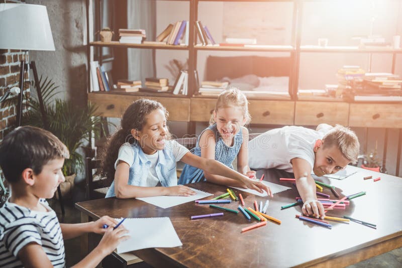 multiethnic group of happy children drawing pictures together stock image multiethnic group of happy children drawing pictures together stock image