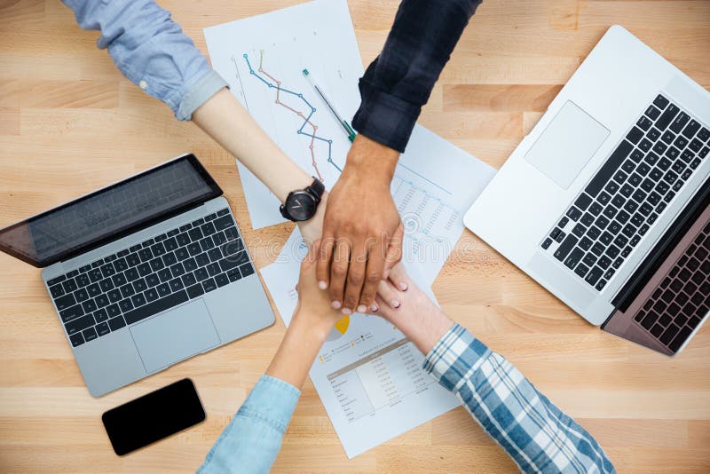 Multiethnic group of people working and joining hands together royalty free stock photo Multiethnic group of people working and joining hands together royalty free stock photo