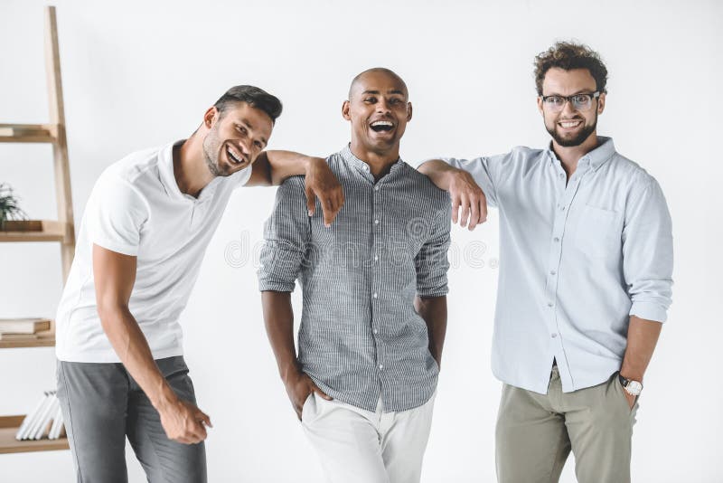 multiethnic group of young smiling businessmen standing royalty free stock image multiethnic group of young smiling businessmen standing royalty free stock image