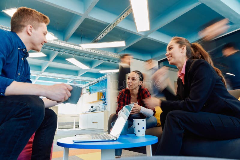 Multiethnic startup business team on meeting in a modern bright open space coworking office. Brainstorming, working on royalty free stock photos