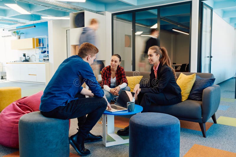 Multiethnic startup business team on meeting in a modern bright open space coworking office. Brainstorming, working on royalty free stock images