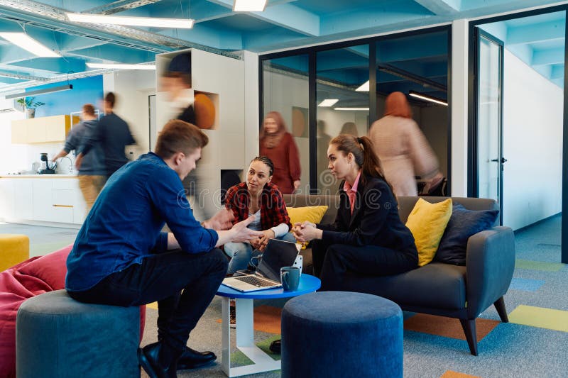 Multiethnic startup business team on meeting in a modern bright open space coworking office. Brainstorming, working on royalty free stock photos