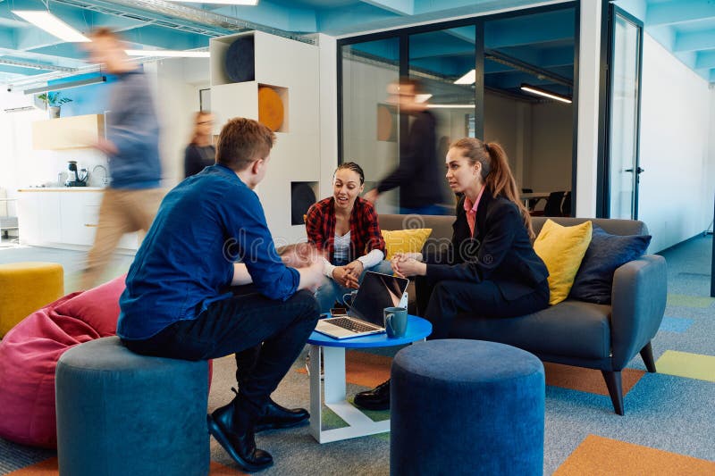 Multiethnic startup business team on meeting in a modern bright open space coworking office. Brainstorming, working on stock photography