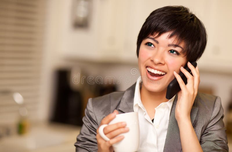 Multiethnic Woman with Coffee and Cell Phone