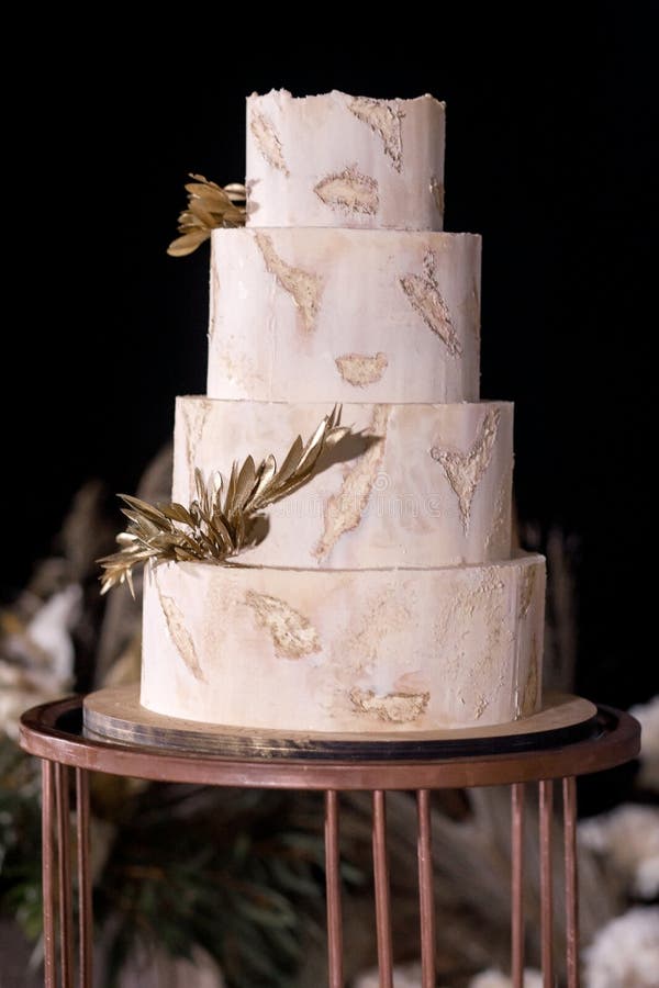 Multilevel Wedding Cake Decorated with Gold Flowers Stock Photo Image