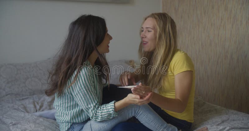 Multinational Lesbian Couple. Two Young Women Lesbian Girls Show Each Other a Pregnancy Test and are Very Happy that Stock Footage - Video of love, child: 163558540