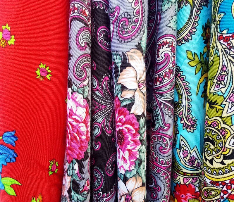 Multiple colorful pieces of traditional simple Polish flowery fabric with floral themes patterns. Multi colored cloth hanging royalty free stock photography Multiple colorful pieces of traditional simple Polish flowery fabric with floral themes patterns. Multi colored cloth hanging royalty free stock photography