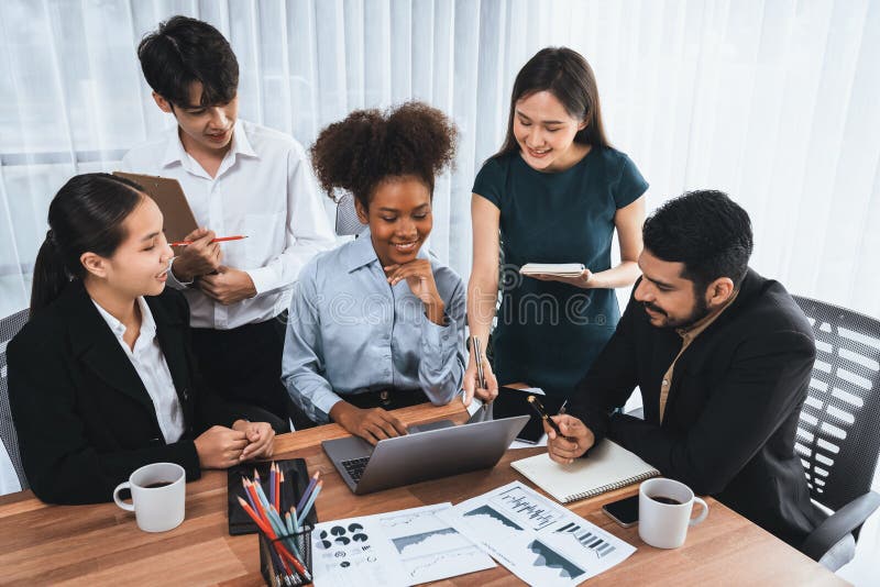 Multiracial analyst team use BI dashboard for data analysis with laptop. Concord stock photo