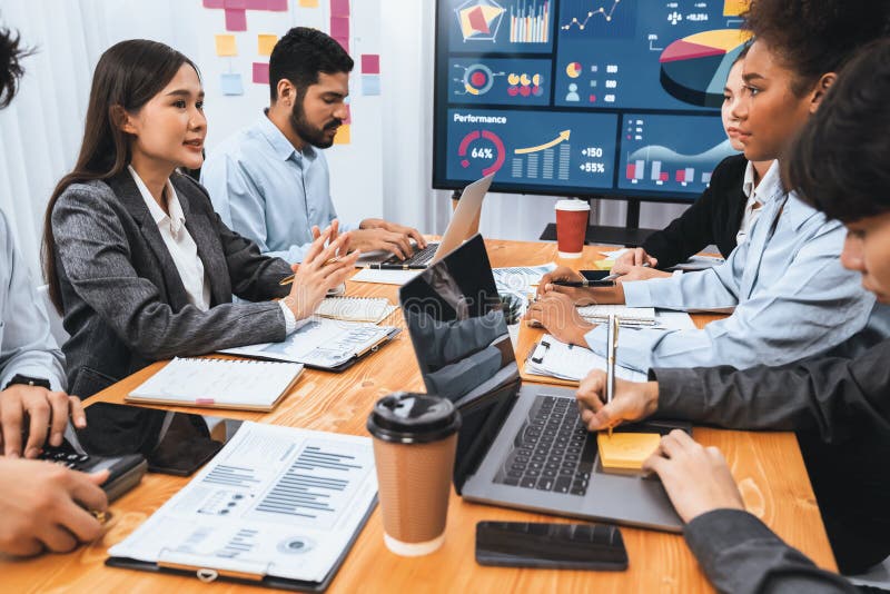 Multiracial analyst team use BI dashboard for data analysis with laptop. Concord stock photography