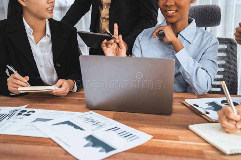 Multiracial analyst team use BI dashboard for data analysis with laptop. Concord royalty free stock image