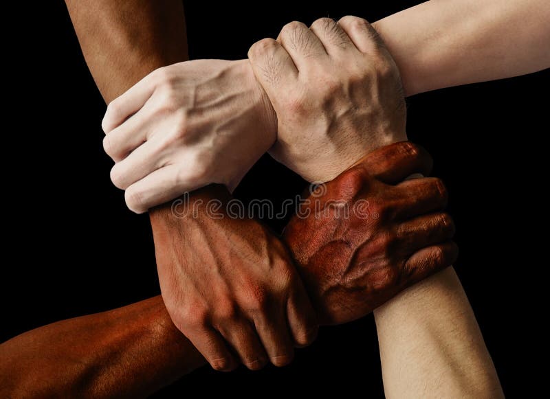 Multiracial group with black african American Caucasian and Asian hands holding each other wrist in tolerance unity love and anti racism concept on black background