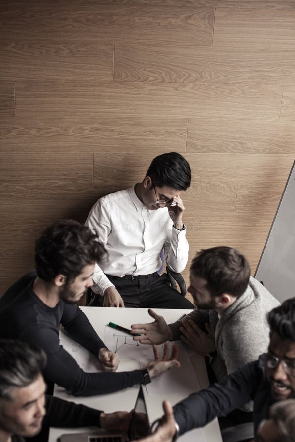 Group of business people in the modern conference room discuss work results. royalty free stock images