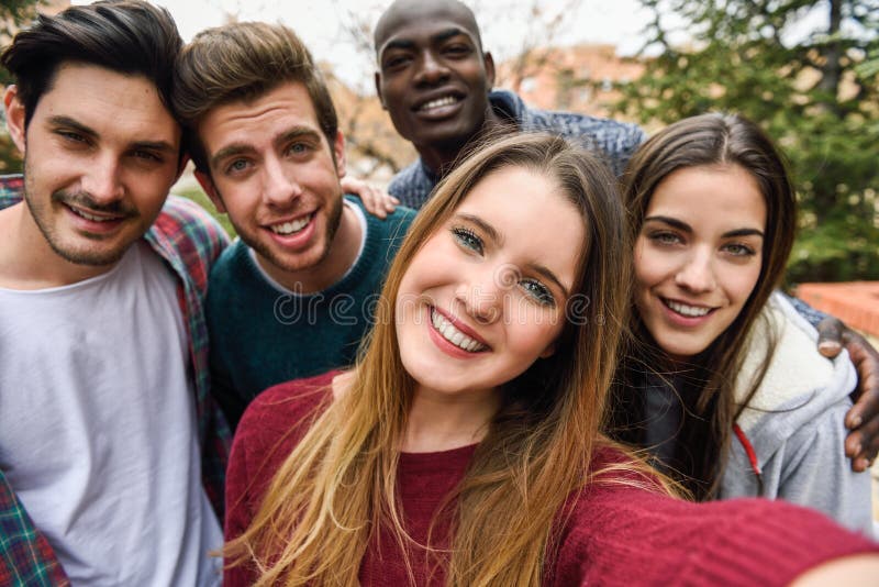 Multiracial group of friends taking selfie